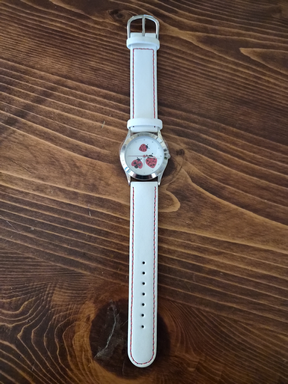 Vintage Avon White Strap Watch with Red Ladybug Dial